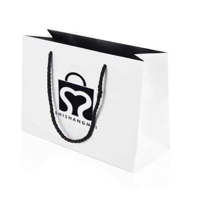 China Recyclable Customize Printed Logo White Clothes Boutique Retail Store Shopping Paper Bags for sale