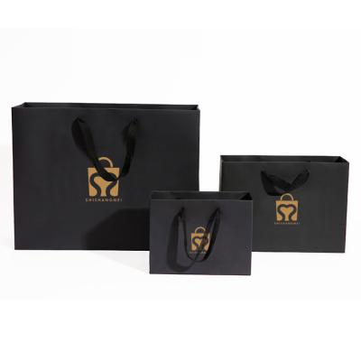 China Recyclable Custom Retail Boutique Full Sizes Shopping Bag Black Logo Gold Foil Print Clothes Paper Tote Bag for sale