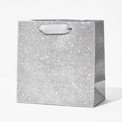 China Recyclable Customized Shiny Logo Clothing Shopping Tote Bags Ribbon Handles Gift Luxury Paper Bags With Glitter Silver for sale