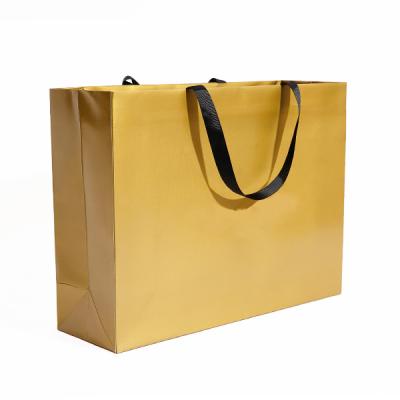 China Matte Gift Packaging Bags Cosmetic Retail Apparel Shopping Recyclable Yellow Paper Bag With Logo Print Custom for sale