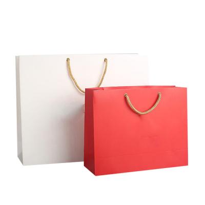 China Recyclable Custom Logo Print Luxury Cosmetic Perfume Gift Packaging Red Cosmetic Paper Bag With PP Handle for sale