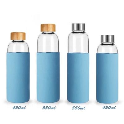 China 450ml 550ml Sustainable Hot-selling Reusable Glass Water Bottle With Silicone Sleeve, Glass Bottle Factory Lid Bamboo Water Bottle for sale