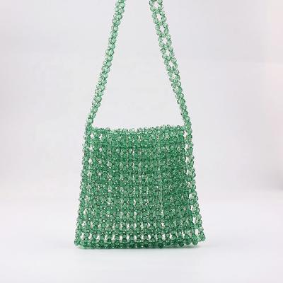 China Solid Color Eco-friendly Handwoven Girls Shoulder Bags Phone Bag Summer Shopping Acrylic Beaded Handbags Custom for sale