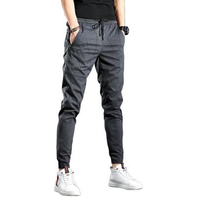 China Anti-wrinkle men's lightweight tracksuit bottoms elastic sports pants gym running joggers slim fit trousers for sale