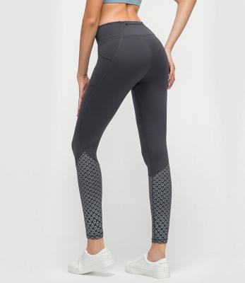 China High-waisted anti-static gmy pocket fitness leggings lift reused yoga pants fitness nine feeling butt print butt bare point for sale