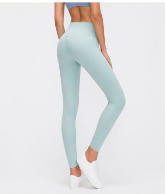 China Anti-Static More Colors Women Yoga Gaiters UN Tight Pants With Pockets High Waist Buttocks Running Stretch Exercise Tight Pants à venda