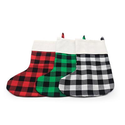 China Custom Printable Buffalo Plaid Canvas Christmas Stocking Blank Sublimation Christmas Stockings en venta