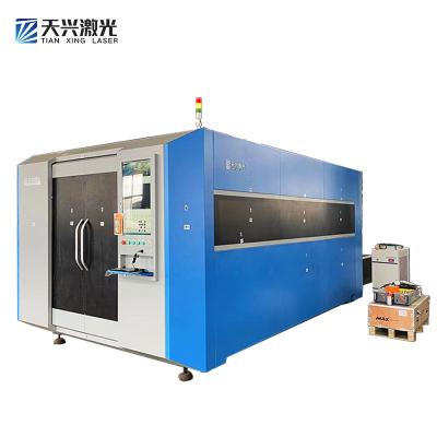 China VISION SYSTEM Fiber Laser Cutting Machine Sheet Metal With Laser And Double Exchange Tables Laser Cutting Machine For Carbon Sheet 1500*3000m for sale