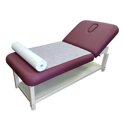 China Beauty salon waterproof and oil proof massage sheet nonwoven roll with cross line and face hole for sale