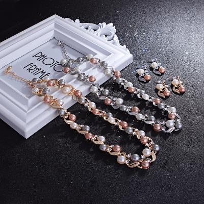 China FASHIONABLE Luxury Imitation Pearl Flower Bridal Metal Wedding Necklace Earrings Gold Plated Jewelry Set For Female for sale