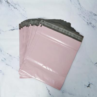 China Custom Lotus Packaging Express Mail Bag Pink Color Pink Ads Shipping Bags Envelope Bag for sale