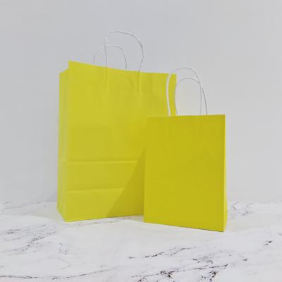 China Recycled Materials Factory Wholesale Yellow Packaging Bags Reusable Kraft Paper Shopping Bags for sale