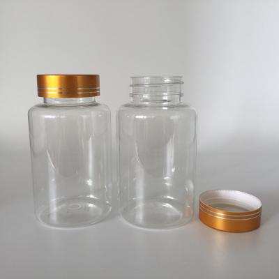 China 150ml capsule bottle with gold metal lid 150ml 150g hot sale plastic clear bottle with gold metal lid, 5 oz capsule pill tablet vitamin bottle packaging food grade for sale