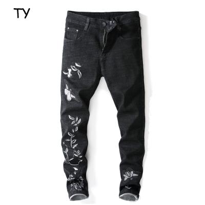 China Black Denim Men's Breathable Jeans With White Plum Embroidered Stretch Feet Jeans Slim Fit Ripped Boys Denim for sale