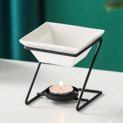 China 2021 Luxury European Metal Oil Burner Wax Warmer Oil Burner Sensitive Romantic Ceramic Tealight Candle Holder Fragrance Heater for sale