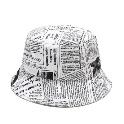 China Different Picture Designs 100% Cotton Beret Hat Fashion Bucket Hats With Newspaper Pattern for sale