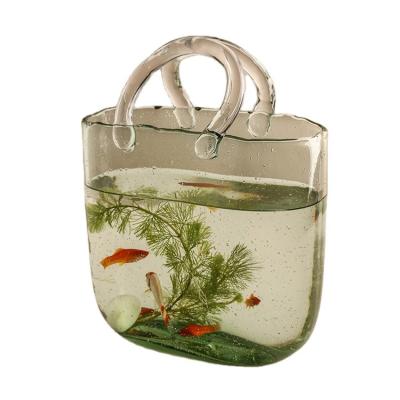 China Art Decor Hand Flower Basket Vase Simple Ornament Transparent Glass Bag Hydroponic Vase Living Room Dining Table Decorations for sale