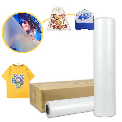 China 30cm 60cm dtf pet film sheet roll for dtf printer for printing t-shirt uniforms for sale