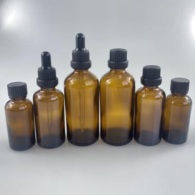 China Wholesale30ml 50ml 100ml Cosmetics Custom Amber Glass Packaging,Essential Oil Bottle With Pilfer-proof Dropper for sale