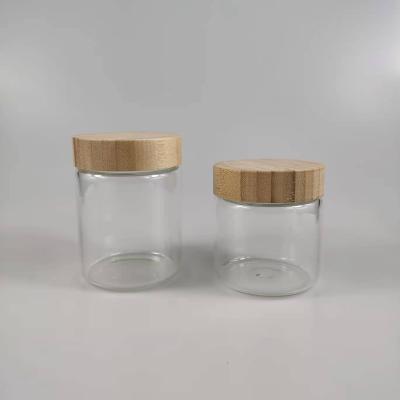 China Non Spill 300ml 350ml High Clear Borosilicate Glass Jar Container Frosted Glass Bottle With Bamboo Lid for sale