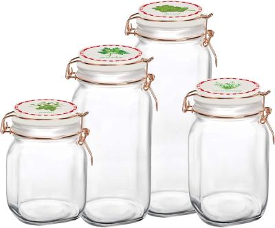 China Clear Glass Freshness Preservation 4pcs Square Storage Jar Set With Ceramic Clip Lids for sale