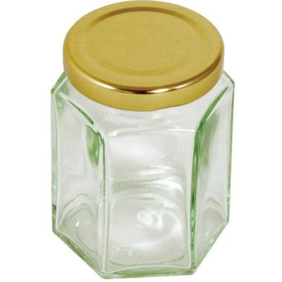 China Freshness Preservation 8oz Glass Honey Jar Hexagon With Screw Lid for sale