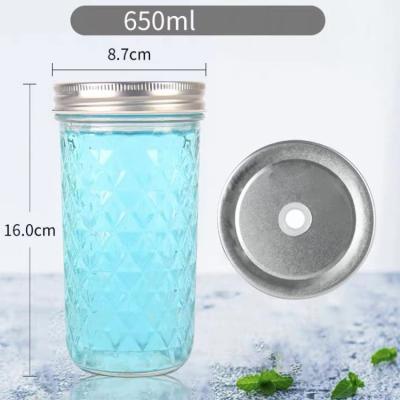 China Steamable 650ml Large Capacity Round Clear Glass Juice Bottle With Metal Lid for sale