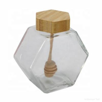 China Hot Selling Unique Empty Clear Hexagonal Glass Honey Jars With Wooden Dipper Freshness Preservation Food Grade for sale