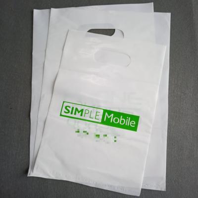 China Low Price BIODEGRADABLE Cheap PE Die Cut Shopping Handle Plastic Bag For Shopping Packaging for sale