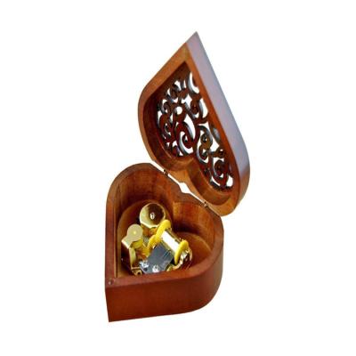 China Christmas Heart Shaped Hollow Gift Design China Laser Engraving Wooden Music Box for sale