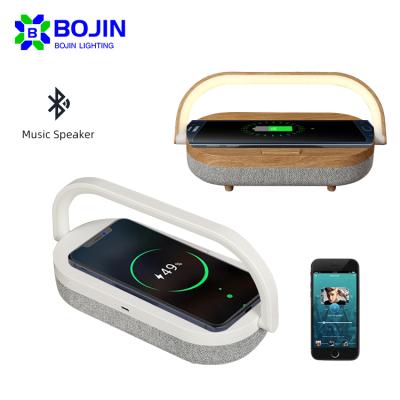 China Modern Portable Bedside 1Watt LED Design Phone Stand Small Music Speaker Wireless Charging Home Night Light for sale