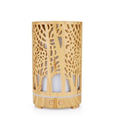 China Hotel factory wholesale Hollow-carved design humidifier wood grain essential oil diffuser with LED light for sale