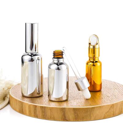 China Cosmetic Luxury Electroplating Glass Dropper Essential Oil Bottle Essential Oil Cans For 10ml Bottles for sale