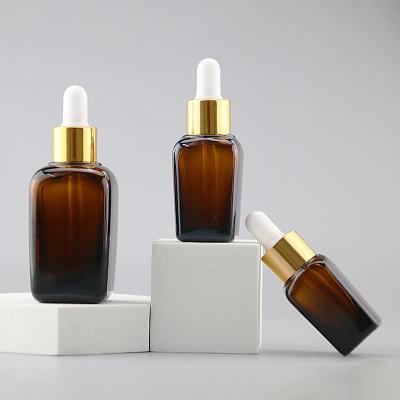 China Cosmetic amber glass serum 10ml oil bottle brown squareessential dropper lotion for essential oil for sale