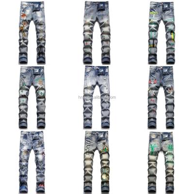 China QUICK-DRY 2022 open-hole graffiti casual jeans are wholesaled by European and American patch men's fashion jeans manufacturers for sale