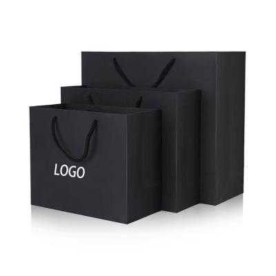 China Custom Luxury Gift Clothing Boutique Shopping Bag Recycled Paper Cardboard Materials Supplier Logo Black Paper Bags With Handles for sale