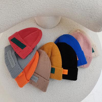 China COMMON Smile Hat Beanie Cute Hemming Knitted Hats Autumn Winter Warm Thicken Cashmere Face Wool For Women for sale