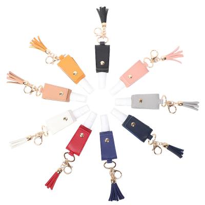 China Durable Portable Refillable Bottles Personal Gift PU Leather Key Chain With Tassel For Bag for sale