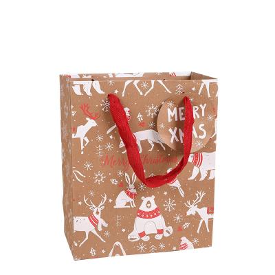 China Recyclable Wholesale Custom Printed Gift Wrapping Present Craft Kraft Paper Shopping Bag With Ribbon Handles for sale