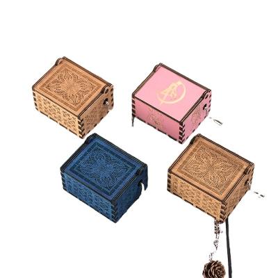 China Hot Selling Engraved Classical Square Wooden Hand Crank Operated Mini Music Box Custom Made for sale