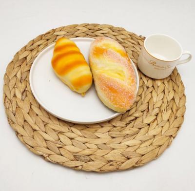 China Sustainable Natural Handmade Straw Weave Rattan Coasters Eco Round Grass Place Mats for sale