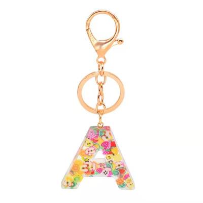 China Hot Fashion Selling 26 Series Custom Epoxy Alphabet Letters Resin Key Chain Fruit Key Chains for sale