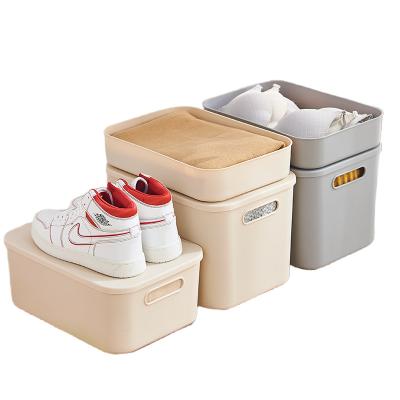 China The contemporary plastic storage box with handle with barrel lid pp storage plastic sundries clothes baskets toys for sale