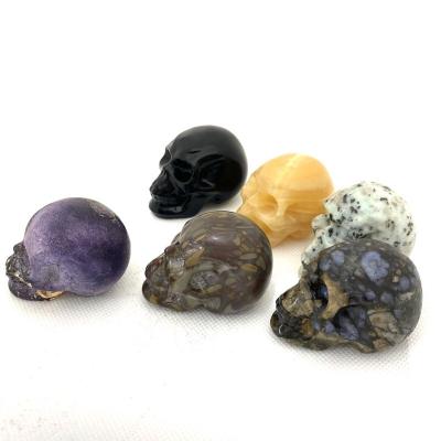 China China wholesale natural crystal different material crystal skulls for home decoration for sale