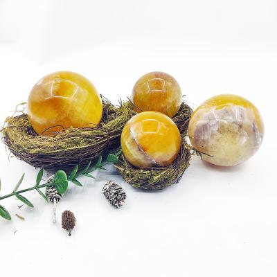 China Natural Polished Calcite Crystal Ball Crystal Balls For Feng Shui Decoration from China Crystal Ball Whole Sale Yellow for sale