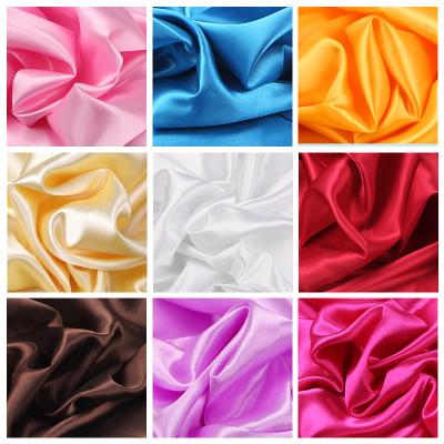 China Breathable Wedding Party Decoration Box Striping Apparel Background Imitation Silk Fabric Shiny Soft Satin Fabric for sale