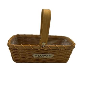 China Small Viable Waterproof Rattan Hand Held Pastoral Flower Arrangement Basket Flower Basket for sale