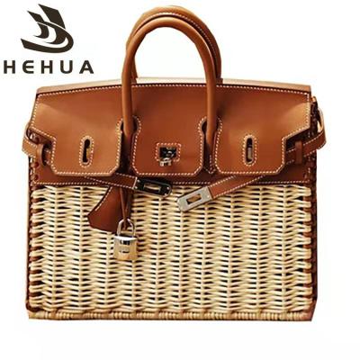 China Fashion New Straw Bag Rattan Holiday Beach Handmade Straw Bag Shoulder Straw First Layer Leather for sale