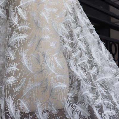 China Handmade Sequins Feather Mesh Fabric Garment Dress Skirt Three-dimensional Sewing Lace Up Fabric 150cm for sale