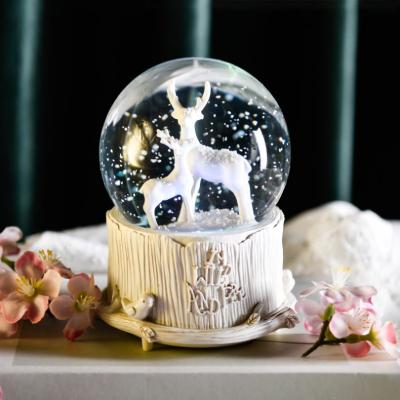 China 100% Handmade Elk Christmas Music Crystal Ball Decoration Creative Birthday Gift Snowflake Music Boxes for sale